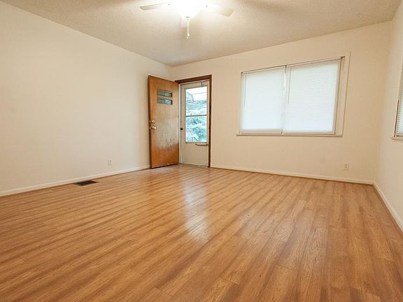 Laminate floor in living room and hallway.