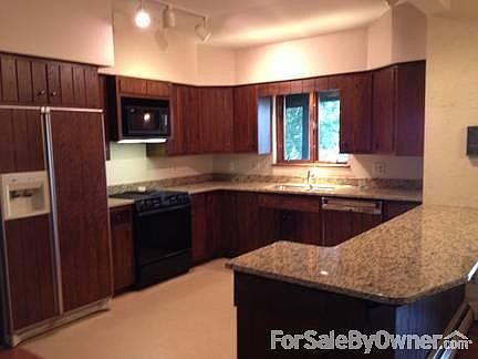 New Granite Countertop Kitchen
						:
						Beautiful granite countertops displayed in kitchen.