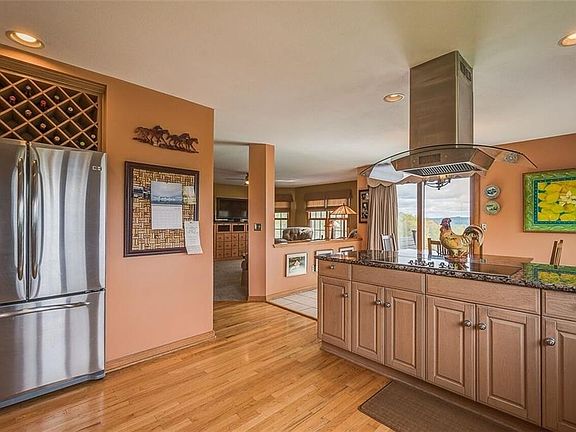 SLIDERS OFF THE EATING AREA LEAD TO HUGE DECK AND SPECTACULAR VIEW!