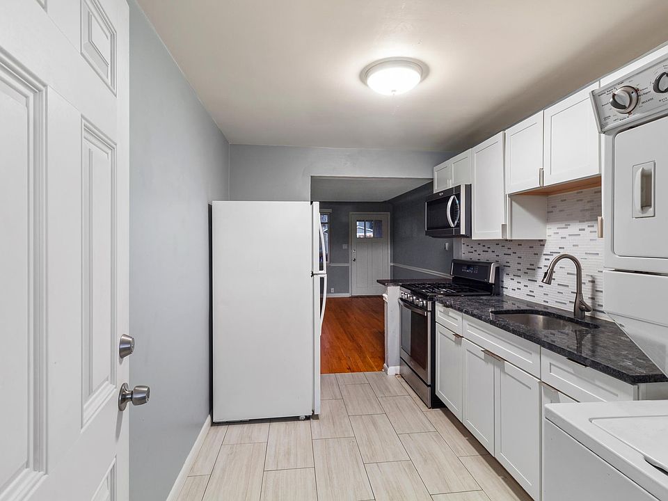 View from back entry. Room for small table and chairs in kitchen.