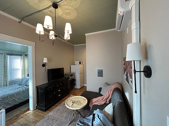 Living room featuring 10 foot ceilings.