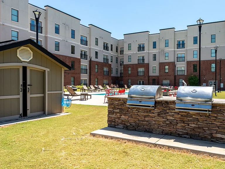 Outdoor grilling area with plenty of seating.