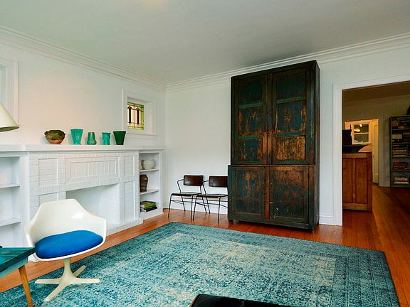 1st floor living room has original stained glass windows