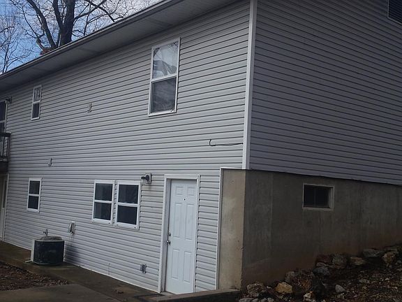 This is Back of Building Front Door of Unit on Right and Door from Kitchen on Left