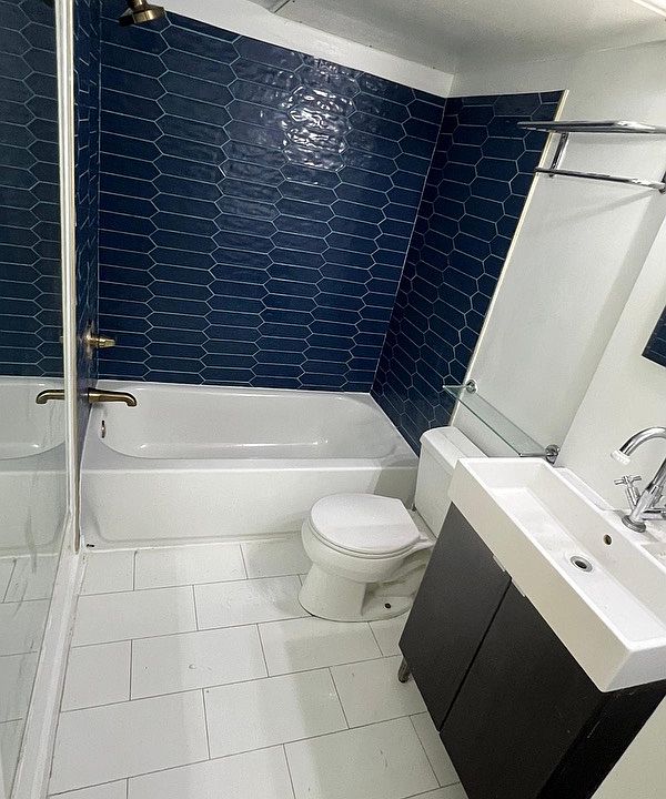 bath with new tub & tile surround, high-end fixtures