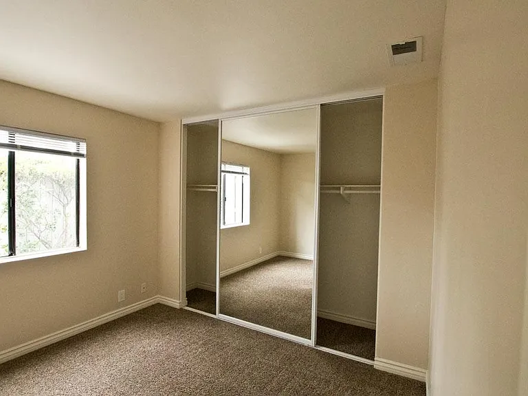 This bedroom is downstairs. It is 10.4 x 11 and has a closet that is 10.4 long.