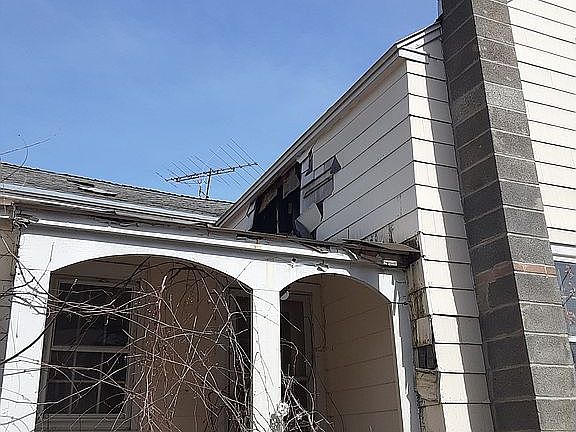Above side porch 