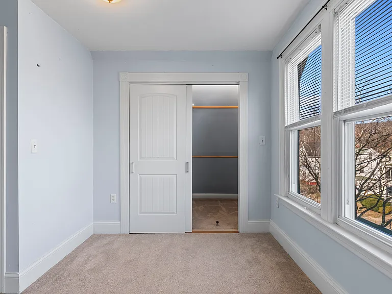 Front Bedroom with walk-in closet with individual lighting