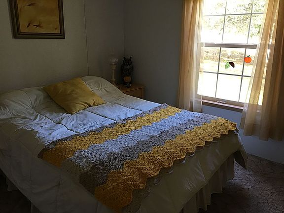 Spare yellow bedroom