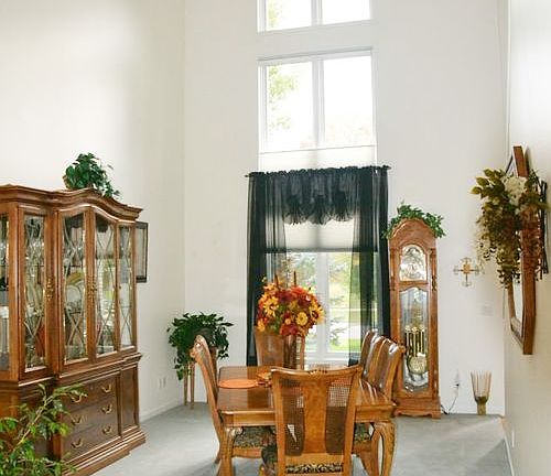 The Formal dining room is located just to the other side of the main entrance.  It features a 2 story vaulted ceiling and has plenty of space for those special entertaining events.