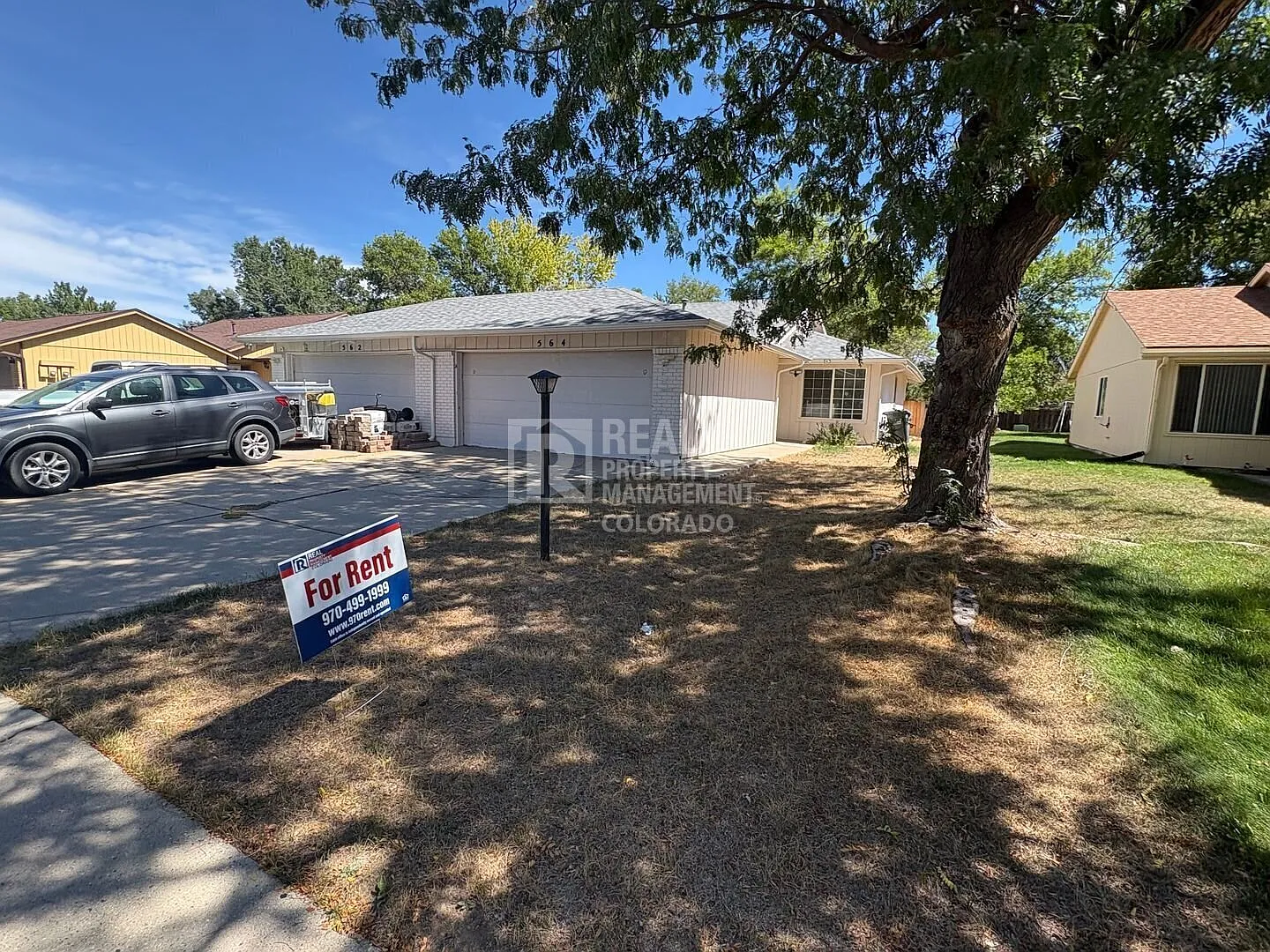 Pet-Friendly Duplex with Large Fenced Yard in Loveland! 564 Jocelyn Drive Loveland, CO 80537 — Photo 1