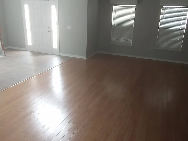 Main entrance and downstairs front living room w/ bamboo floors. Front Living Room Bamboo Floor area size : 14' x 21'