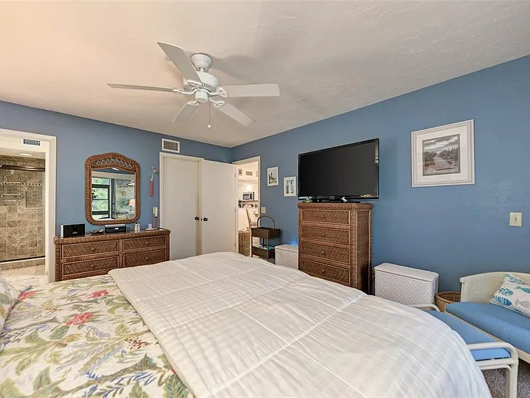 King-sized comfort meets coastal living. __ With a plush pillowtop mattress, a walk-in closet, and direct access to both the lanai and a private bath, the primary suite at Unit 1003 has it all. Your "Home Away From Home" just got a major upgrade.