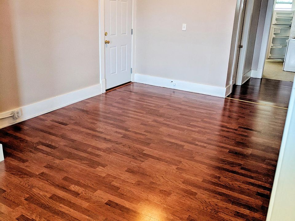 Dining Room and view of front, exterior door (left) and hallway into kitchen.
