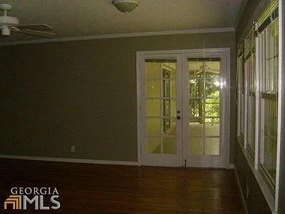 Family room with door to screened in porch