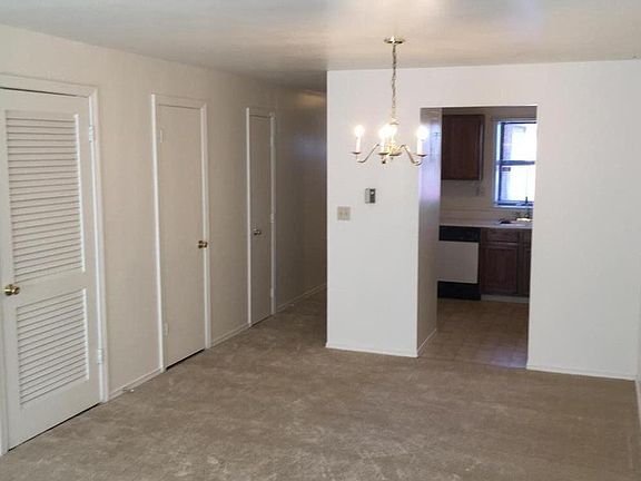 Dining Room, temperature controls on wall, coat closet, under stairs storage closet, and half bath located on first floor