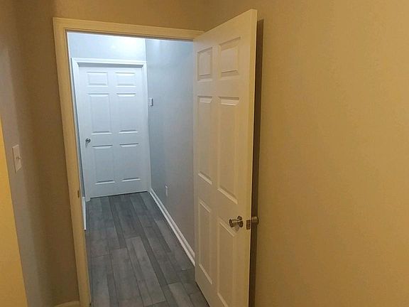 Bedroom #1 leading into hallway next to bathroom __
