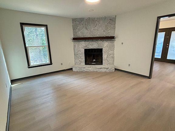 Living Room with view of entrance to kitchen and French Doors to patio.