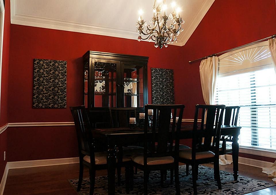 Dining Room has high ceilings and Chandelier.
