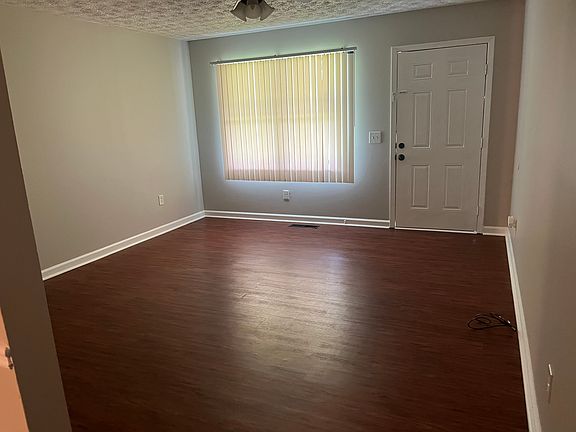 Den/family room with ceiling fan/light.