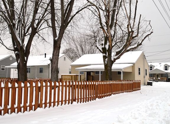Back view with wood fence