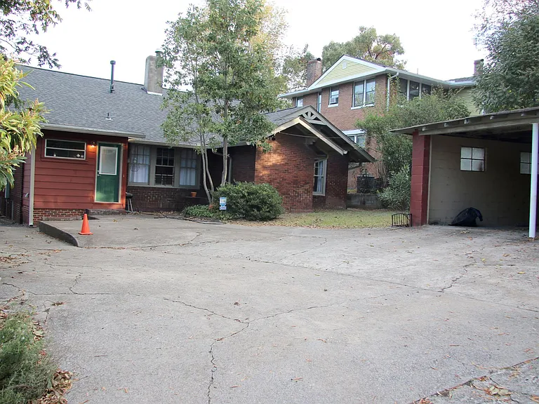 Backyard parking pad and 2 car garage.