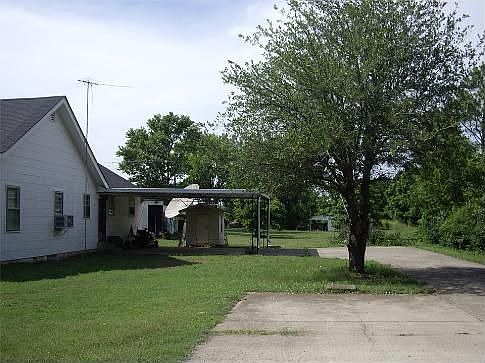 Side view of house with carport