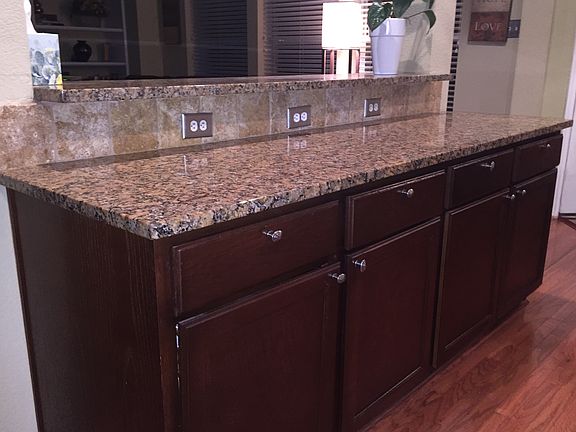 Granite countertops/refinished cabinets