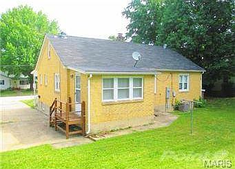 View of back and driveway side of the home.