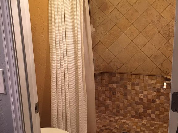 Master bathroom and shower. Separate enclosure from vanity, which is off the master bedroom but outside the shower room.