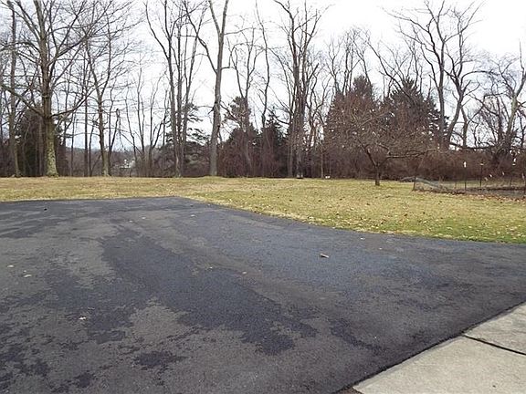 Top of driveway in front of the out building.