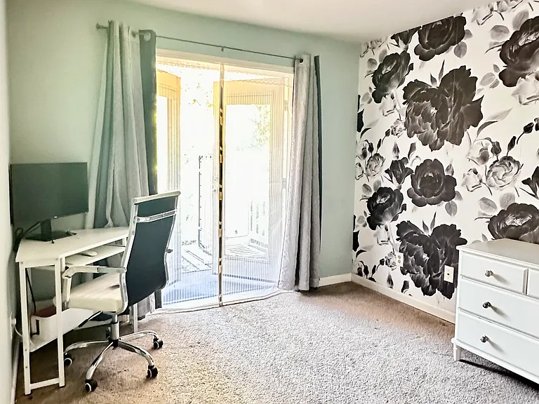 Second bedroom/office with French doors that open up to the private deck