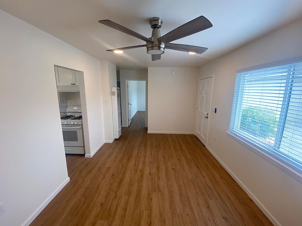 Spacious living room. New overhead fan and recessed lighting.