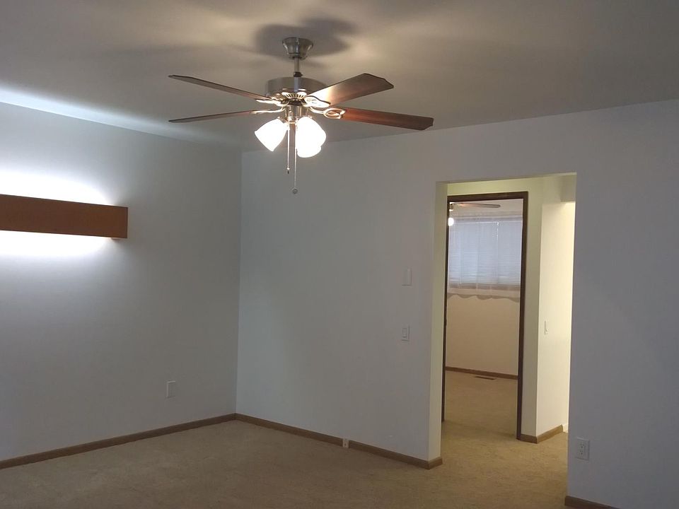 Living room with midcentury handmade light panel on west wall