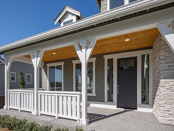 Tustin plan 4358 SF plan on lot 8 is Under Construction with an end of Dec. completion.  Photos are of a different home with a left side front porch ( from a different community), but with a different Elevation (A).  Color, design, details and finishes are subject to change.