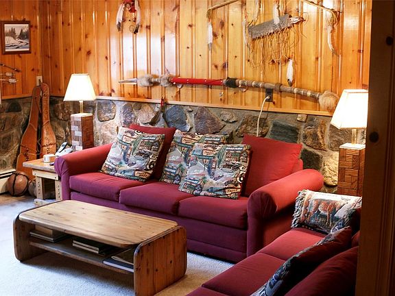 Lower level living room has a door to the side yard.