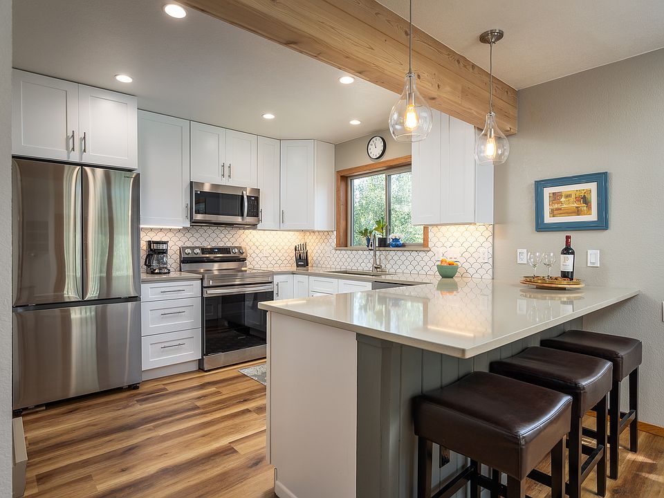 Kitchen with new appliances and fully furnished with coffee pots and all dishes.