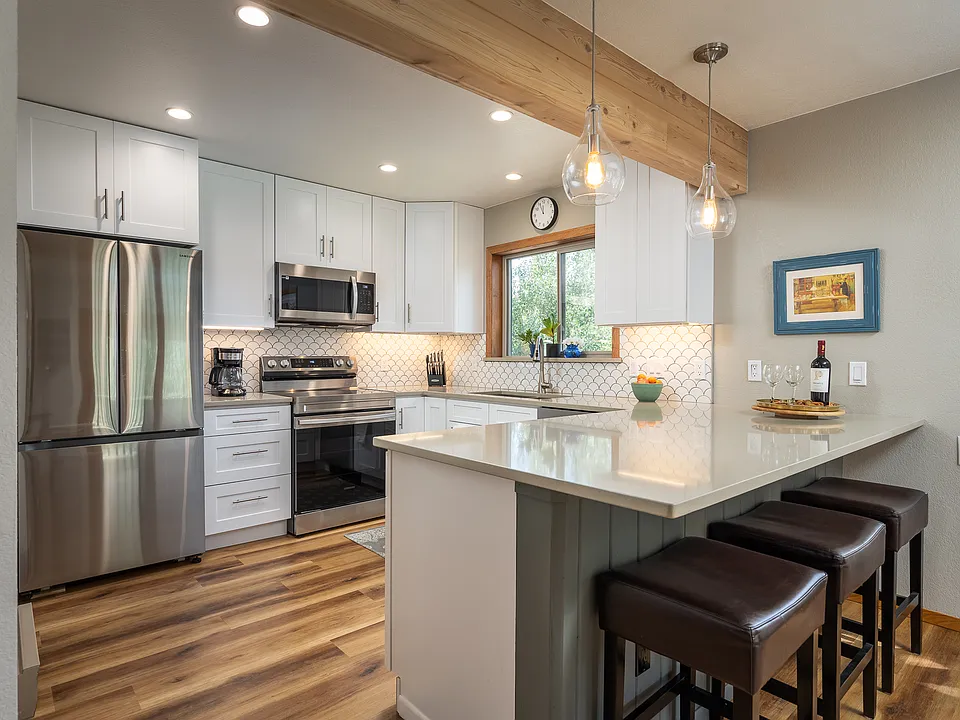 Kitchen with new appliances and fully furnished with coffee pots and all dishes.