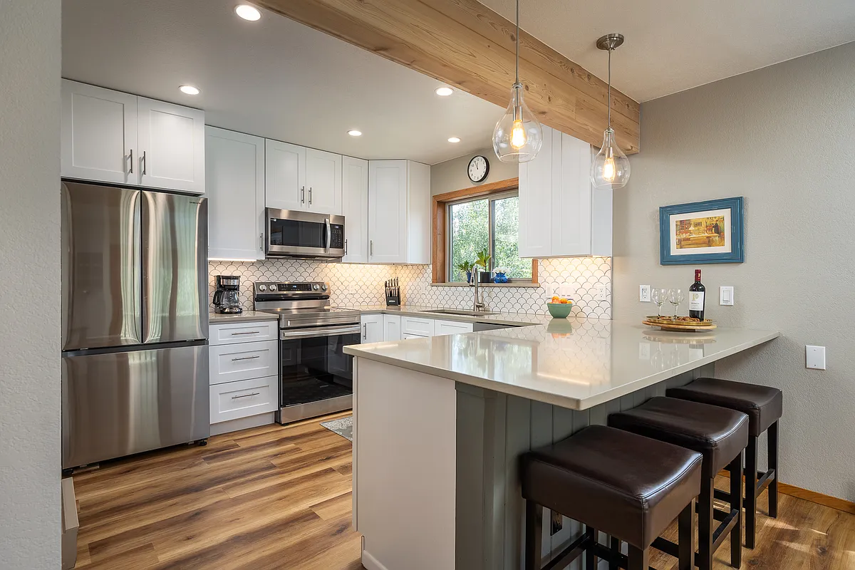 Kitchen with new appliances and fully furnished with coffee pots and all dishes. - 860 Wolverine Ln #A