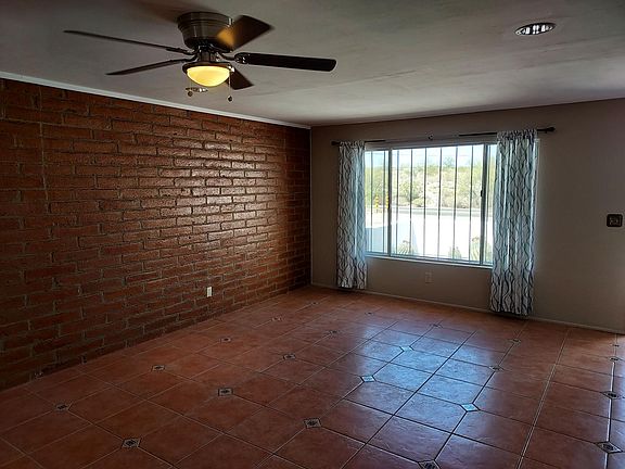 Great room (north end) with large window, city and mountain views