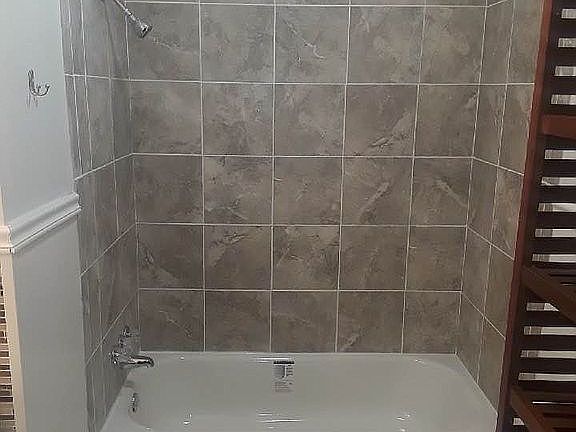 New tub with tile.