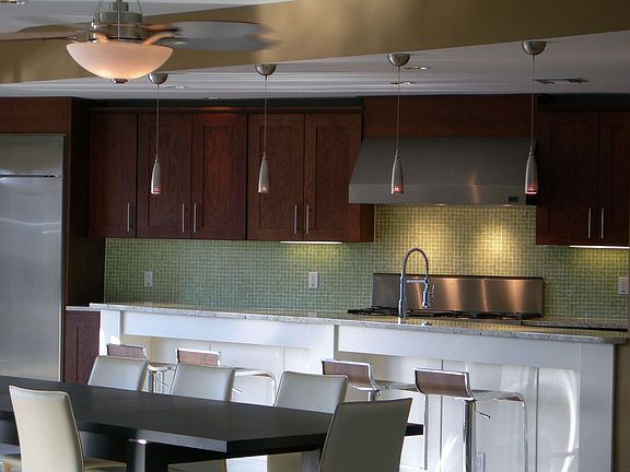 Brookwood Milan Cabinets, Stainless Appliances, Custom Granite Counter Tops