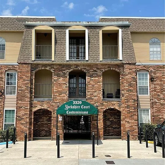 Yorkshire Court Condominiums offers a welcoming community setting with convenient guest parking located near the building entrance.