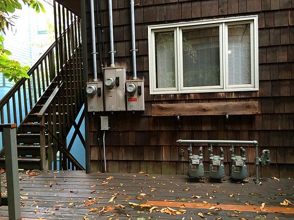 Front of triplex, stairs going up to #1406 on left