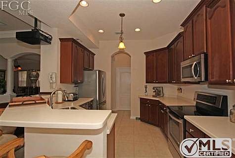 The Kitchen Has Corian Countertops, Stainless Steel Appliances, And Real Wood Cabinets With Crown Molding!!