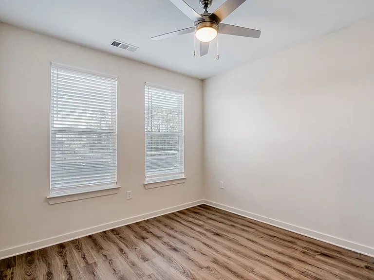 Unit Bedroom with Ceiling Fan and 2 Windows