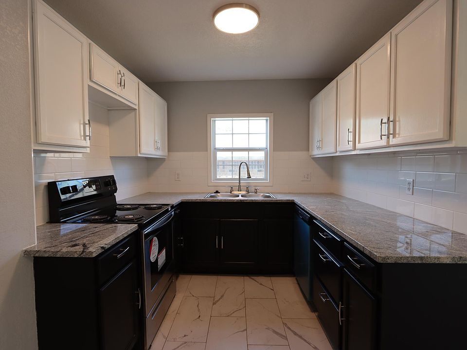 Kitchen with new appliances and granite countertops