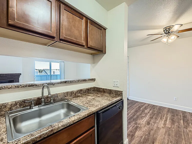 Experience seamless living with this open kitchen, offering style and convenience in one bright space.