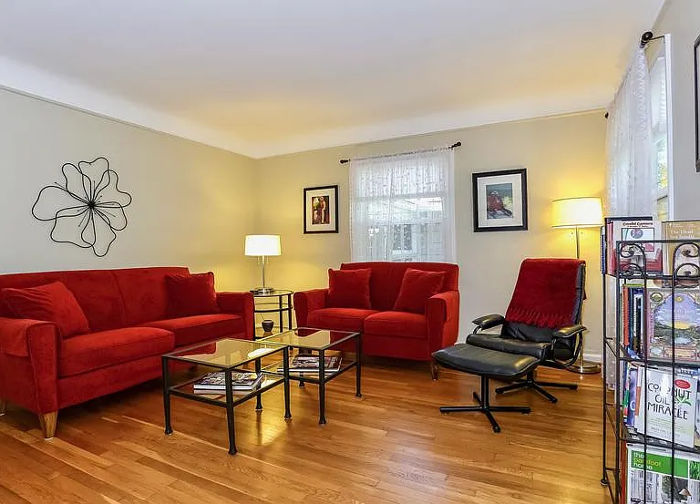 The living room is a great place to gather, read and watch movies on the big screen television.