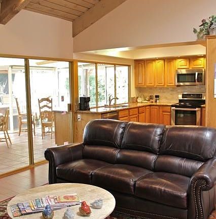 Beautiful interior with open-beamed ceilings and skylights.